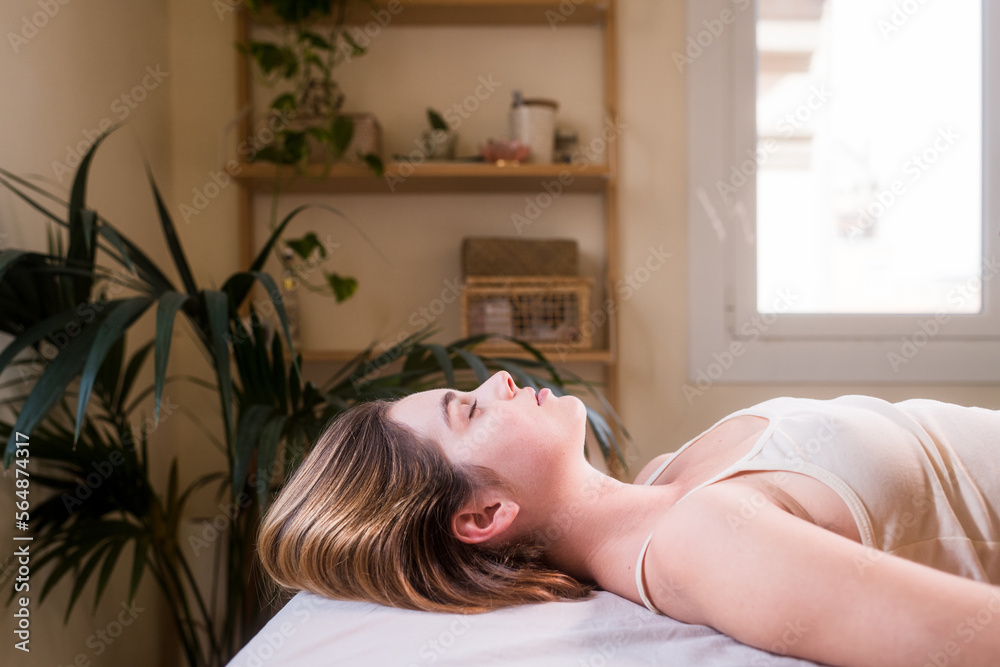 Lying woman enjoying relaxed moment at spa Lying woman enjoying relaxed moment at spa