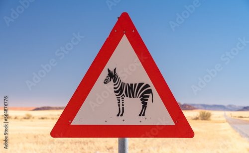 Zebra crossing danger sign in a gravel road, Namibia, Africa