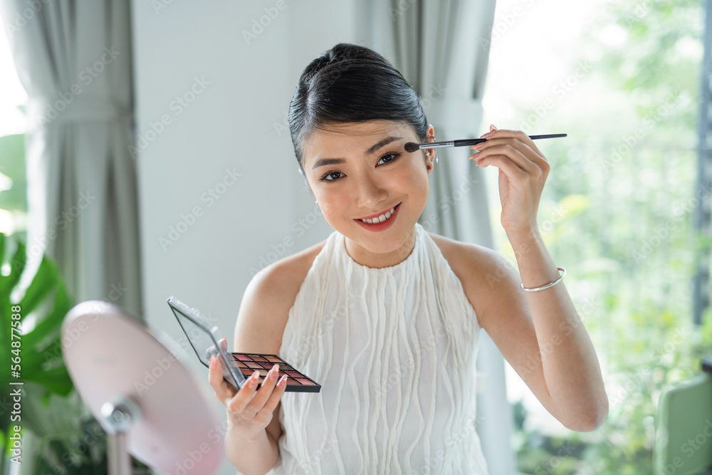 Beauty blogger woman filming daily make-up routine tutorial Beauty blogger woman filming daily make-up routine tutorial