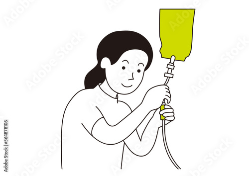 点滴の準備をしている女性看護師
