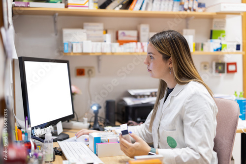 Pharmacist working with computer