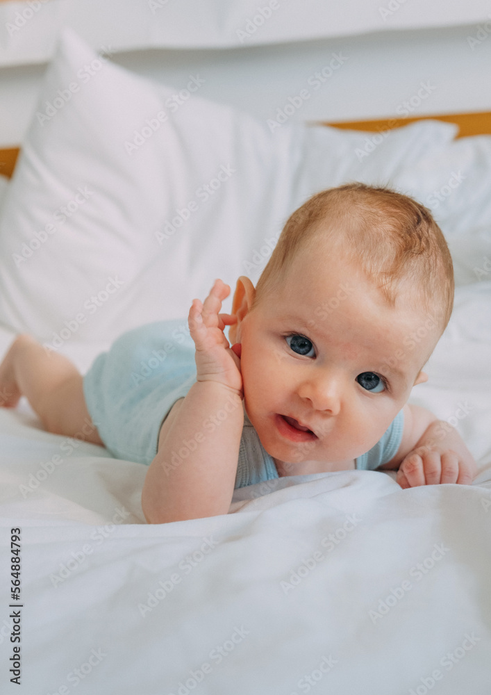 baby crawling on  bed 
