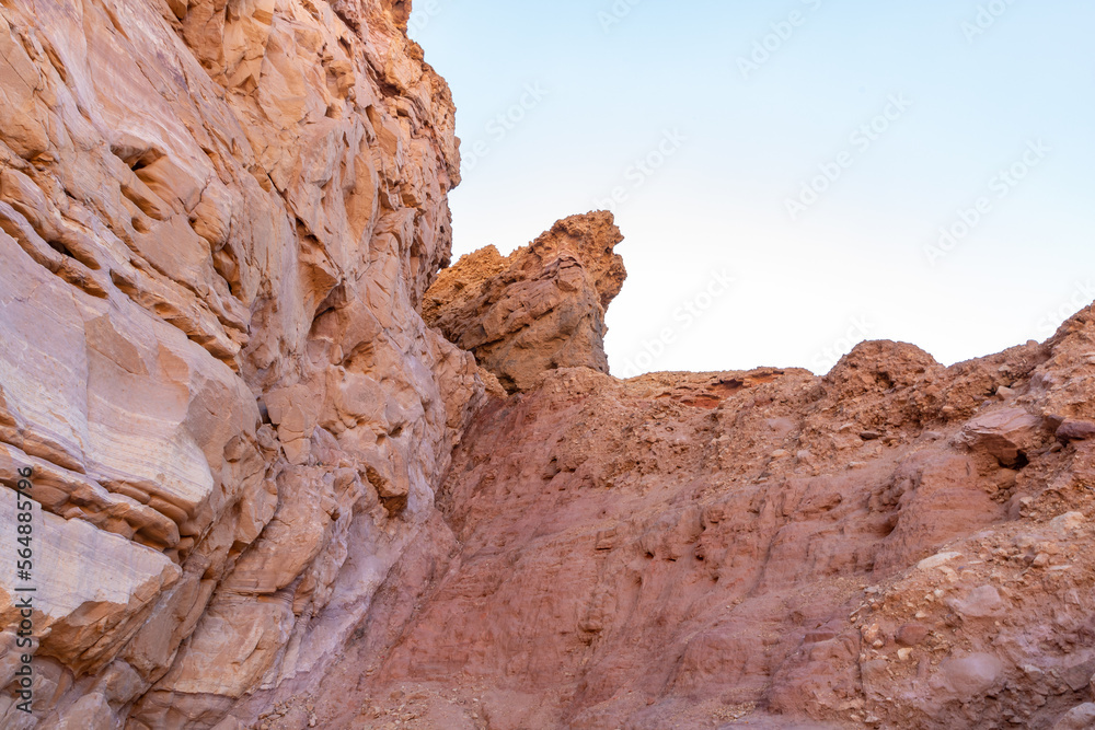 Fantastically beautiful landscape in the national nature reserve - Red Canyon in the rays of the setting sun, near the city of Eilat, in southern Israel