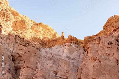 Fantastically beautiful landscape in the national nature reserve - Red Canyon in the rays of the setting sun, near the city of Eilat, in southern Israel