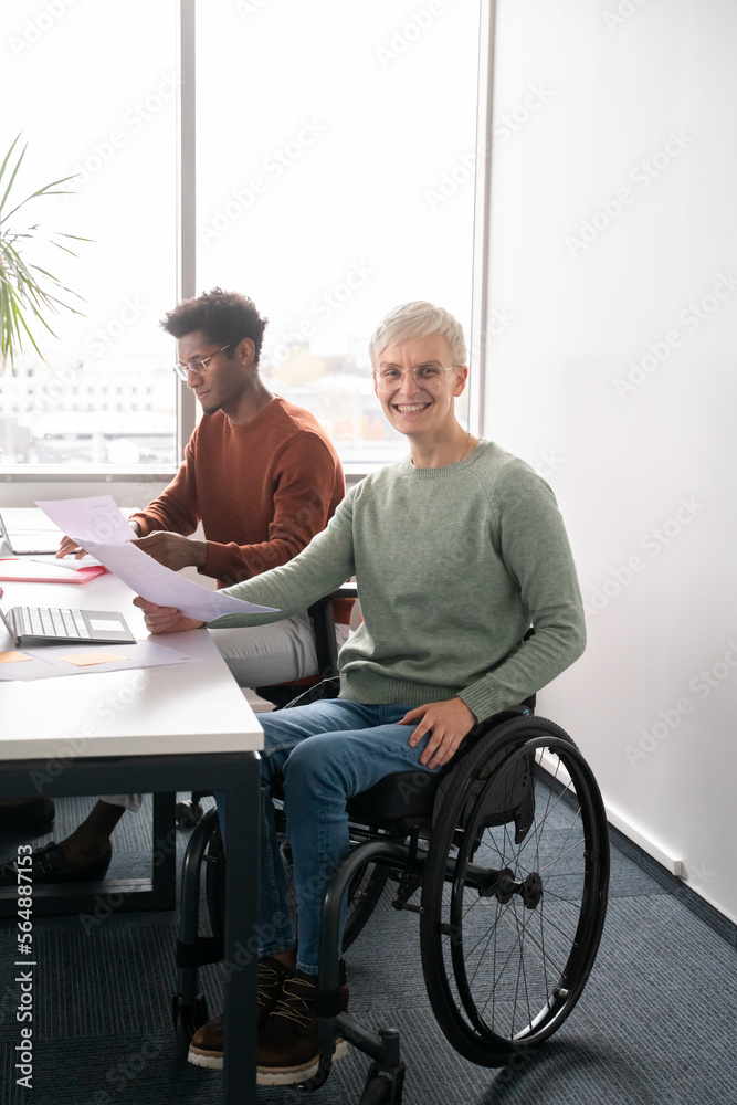 Woman In The Wheelchair Portrait At Office Desk Woman In The Wheelchair Portrait At Office Desk
