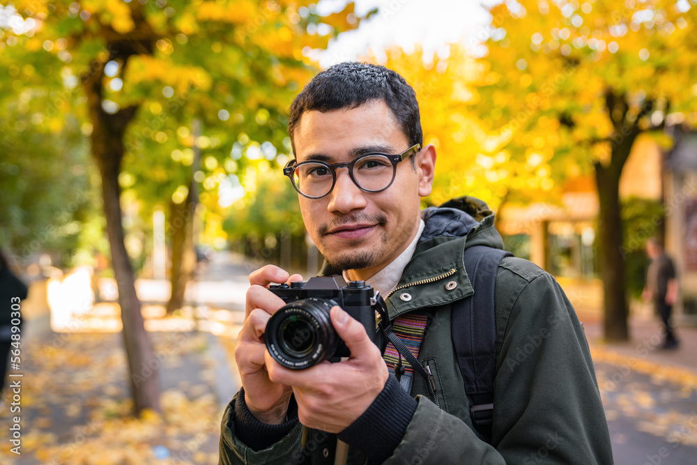 Young Man Photographer Outdoors during Autumn Season Young Man Photographer Outdoors during Autumn Season