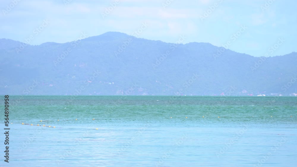 Serene Ocean With Misty Mountains At The Background In Koh Samui, Thailand. Wide Shot Serene Ocean With Misty Mountains At The Background In Koh Samui, Thailand. Wide Shot