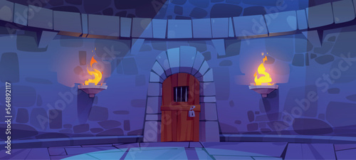 Castle dungeon with old wooden door. Vector cartoon illustration of medieval building stone wall, locked prison entrance illuminated with torch fire at night. Fortress tower facade for game background