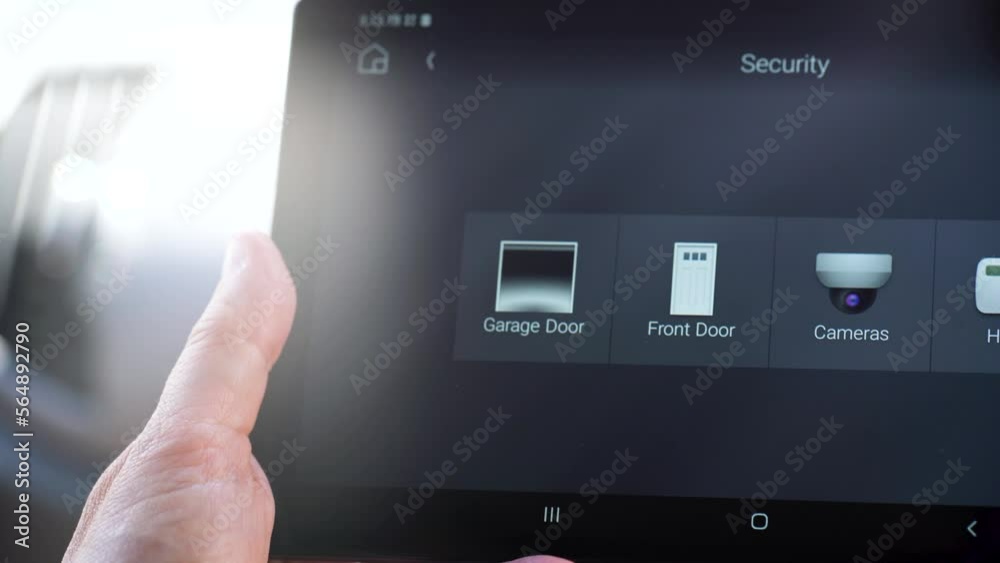 Close up of a woman's finger using a digital interface to open garage door, smart housing. (4K)