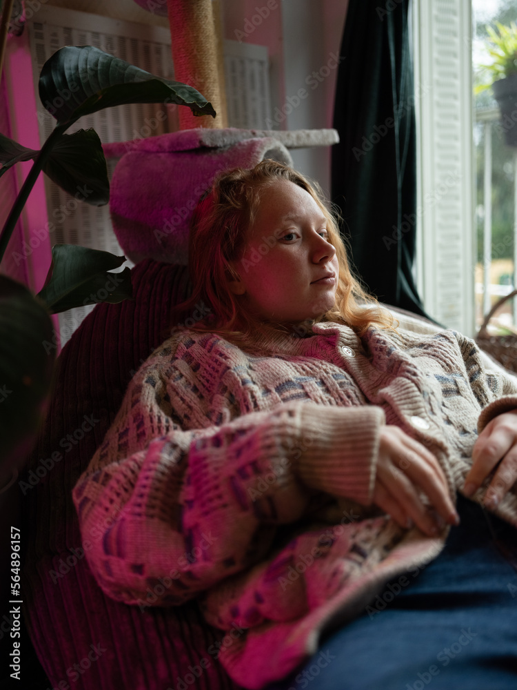 Redhead girl resting in a cosy home Redhead girl resting in a cosy home