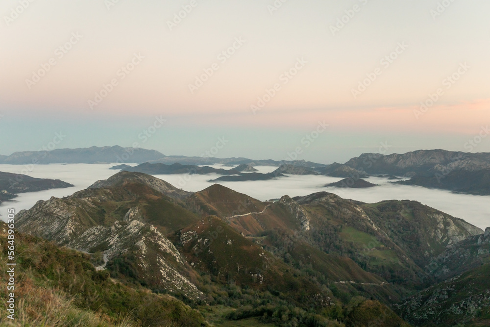 landscape with mountains full of clouds at sunrise landscape with mountains full of clouds at sunrise