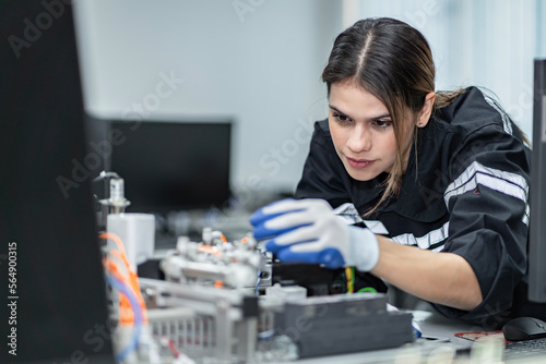 Wallpaper Mural Team woman of engineers practicing maintenance Taking care and practicing maintenance of old machines in the factory so that they can be used continuously. Torontodigital.ca