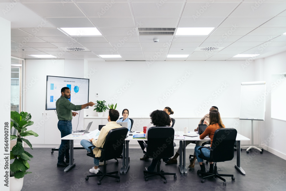 Businessman making a presentation at a meeting in the office Businessman making a presentation at a meeting in the office