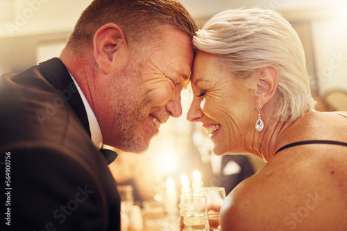 Love, forehead or senior couple in a party in celebration of goals or new year at luxury social event. Romance, happy woman or romantic man smiles enjoy an embrace or bonding at dinner gala together