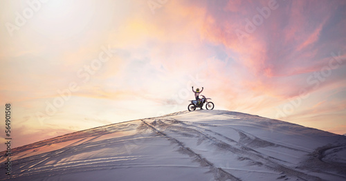 Desert, sunset and man riding a motorcycle for exercise, fitness or skill training in nature. Extreme sports, dusk and male athlete on a bike for an outdoor evening workout in the sand dunes in Dubai