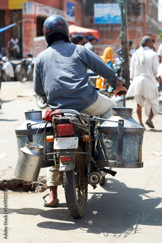 Milk cans bing transported in Jaipur photo