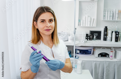 Cosmetologist making mesotherapy injection with dermapen on face for rejuvenation on the spa center. Cosmetologist making mesotherapy injection with dermapen on face for rejuvenation on the spa center