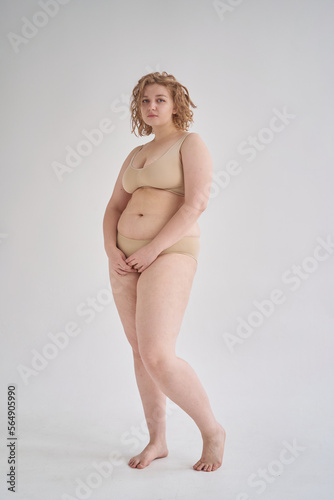 Calm curvy woman in underwear photo