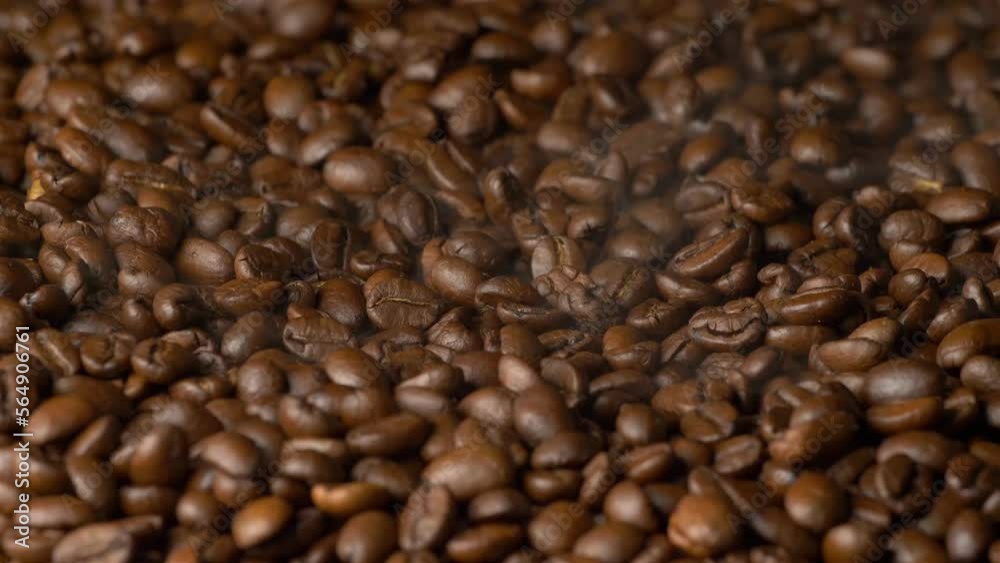 Roasting coffee beans. Aroma of coffee. Smoke comes from coffee beans. Coffee beans. Roasting coffee beans. Aroma of coffee. Smoke comes from coffee beans. Coffee beans.