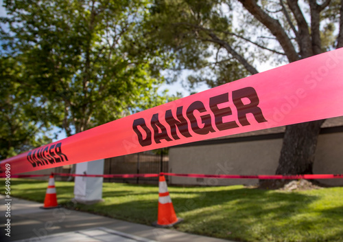 Foto Red construction tape that states Danger