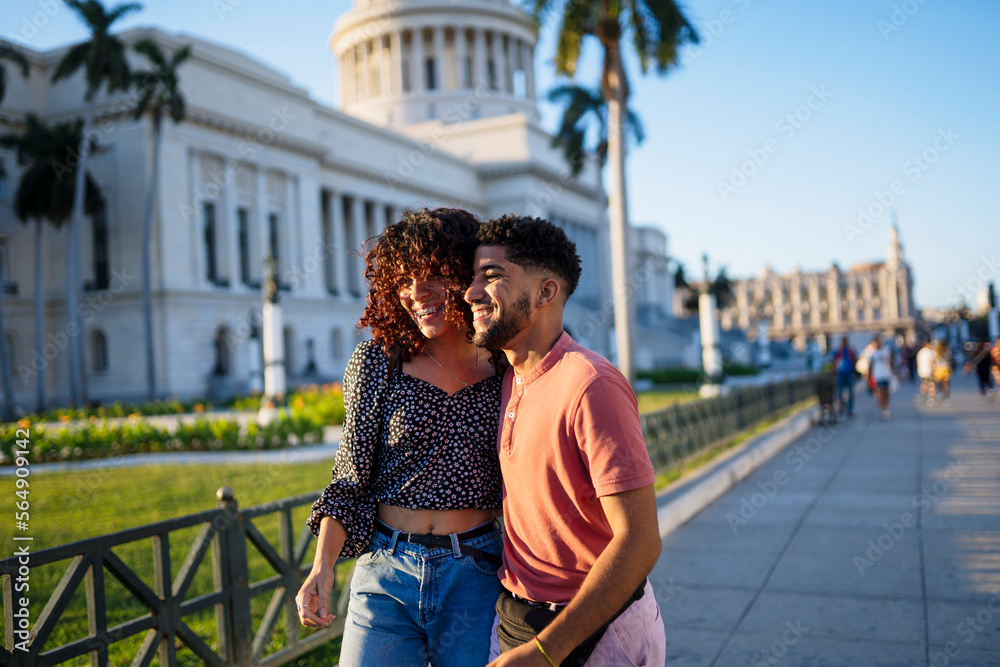 © Daniel Gonzalez/Stocksy - Delightful soulmates walking on street