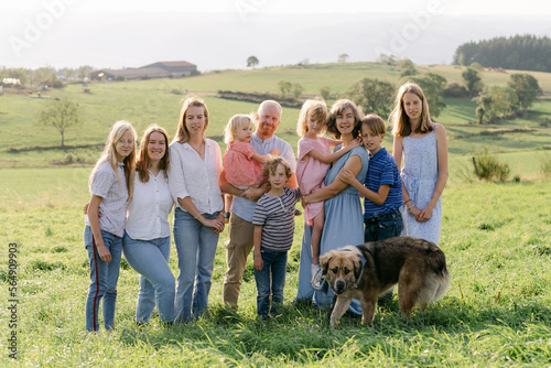 family with 8 children in field  photo