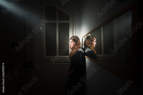 Surreal portrait of woman with spotlight