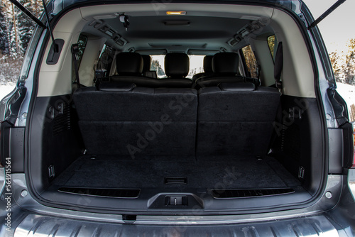 Huge, clean and empty car trunk in interior of compact suv. Rear view of a SUV car with open trunk © Roman