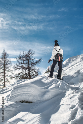 A woman on a snowshoeing trip