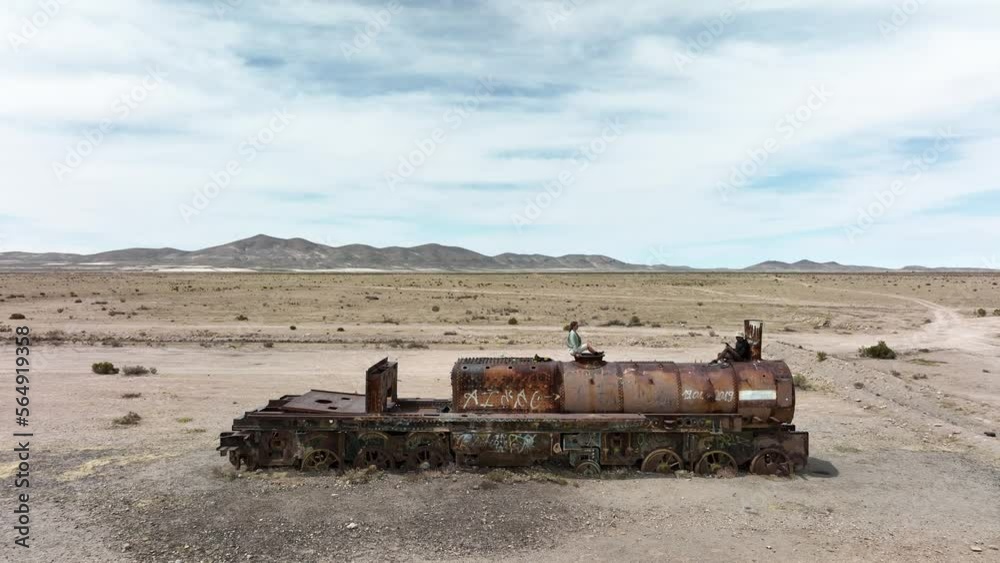 Train Cemetery, Salar de Uyuni, Uyuni Region, Bolivia. Great Train Graveyard in the desert. Aerial drone fly above view high resolution 4k