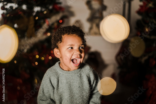 Happy toddler and christmas lights