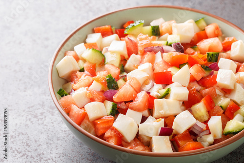 Canvas Print Bahamian conch salad is a vibrant and crunchy salad made using raw pound conch meat and vegetables closeup on the plate on the table