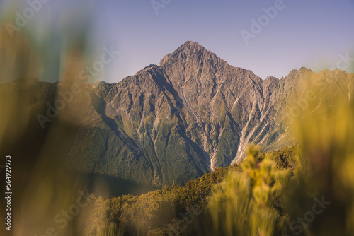 Epic mountain peak in the alps on a summer morning. photo