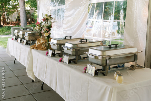 tables with trays of food at an event photo