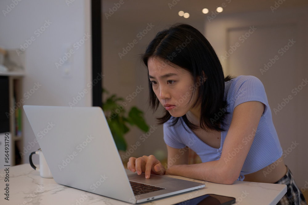 Freelancer reading report on laptop. Freelancer reading report on laptop.