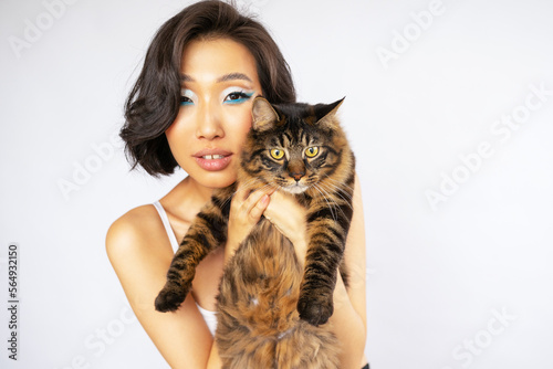 Portrait of Beautiful Young Asian Woman with Bobtail Cat photo