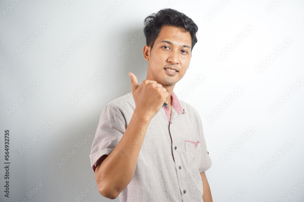 Happy man thumbs up sign full length portrait on white background Happy man thumbs up sign full length portrait on white background