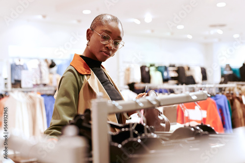 Woman clothes shopping in a store photo