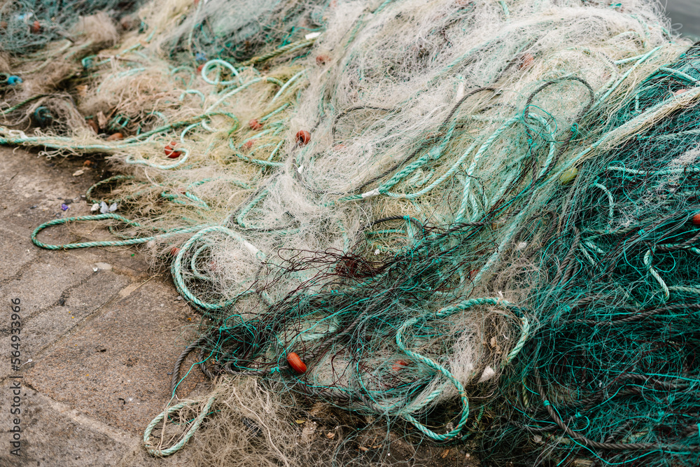 Heap of fishing nets on ground Heap of fishing nets on ground
