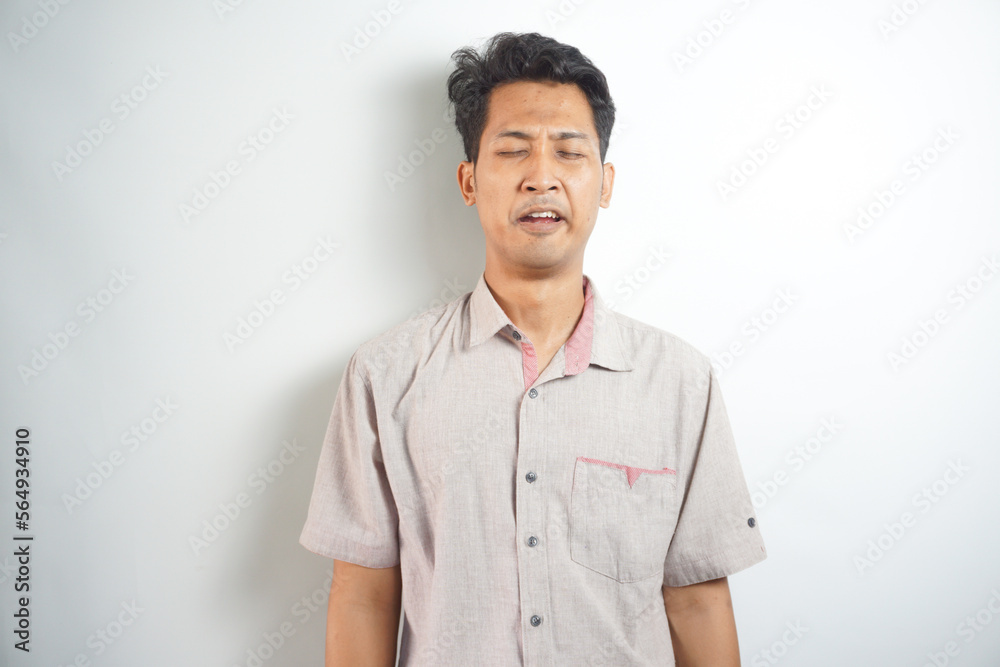 Funny asian man crying wipes tears losing his job. Funny asian man crying wipes tears losing his job.