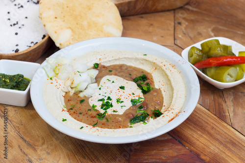 Hummus is a cream of chickpeas cooked with lemon juice, which includes tahini paste and olive oil, which, depending on the local variant, can also include other ingredients such as garlic or paprika.