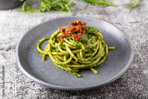 Gragnano spaghetti with homemade rocket pesto and dried tomatoes. Dish suitable for adults and children, healthy and tasty.