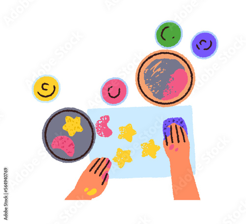 Kid drawing with sponge and paints, top view. Child hands painting on paper f...