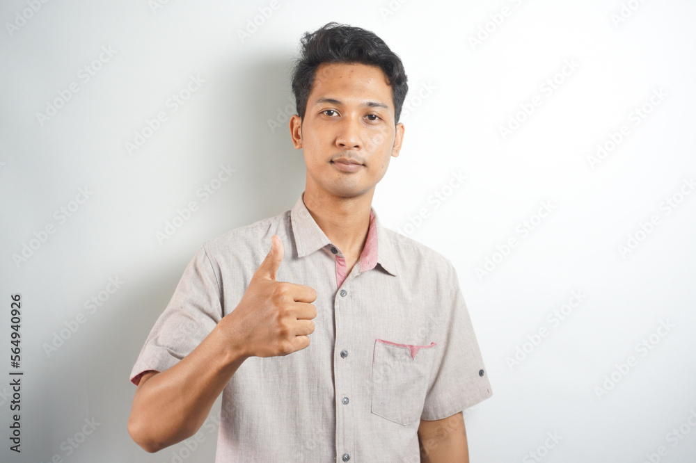 Happy man thumbs up sign full length portrait on white background Happy man thumbs up sign full length portrait on white background