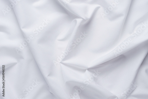 White fabric. luxurious white fabric texture background. Creases of satin, silk and cotton. 