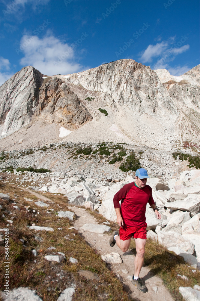 A man trail runs through the Snowy Range in Wyoming. A man trail runs through the Snowy Range in Wyoming.