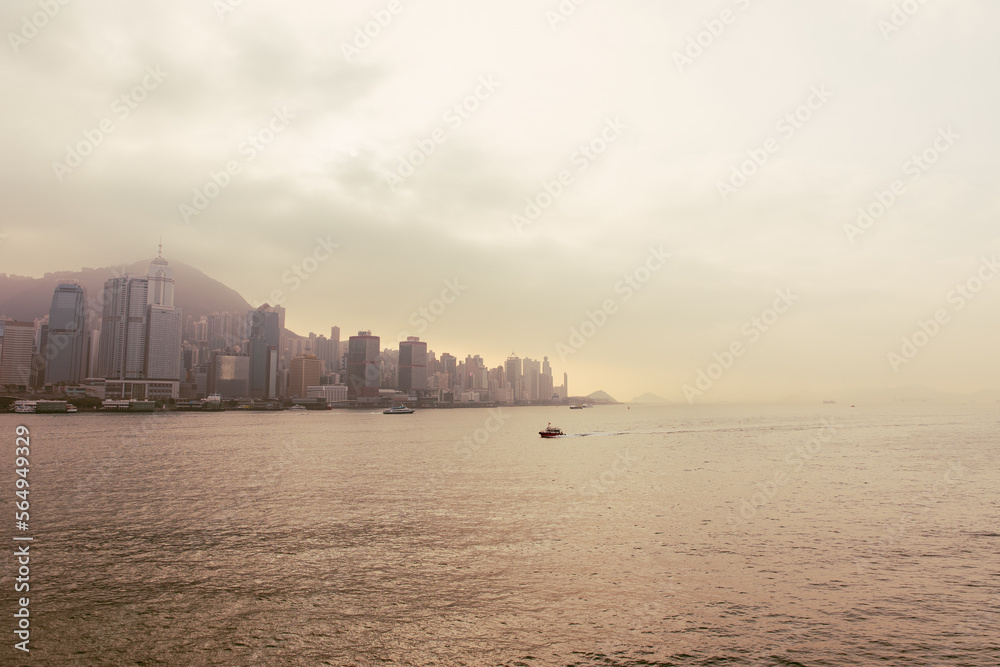 Hong Kong city skyline at sunset, vintage style photography
