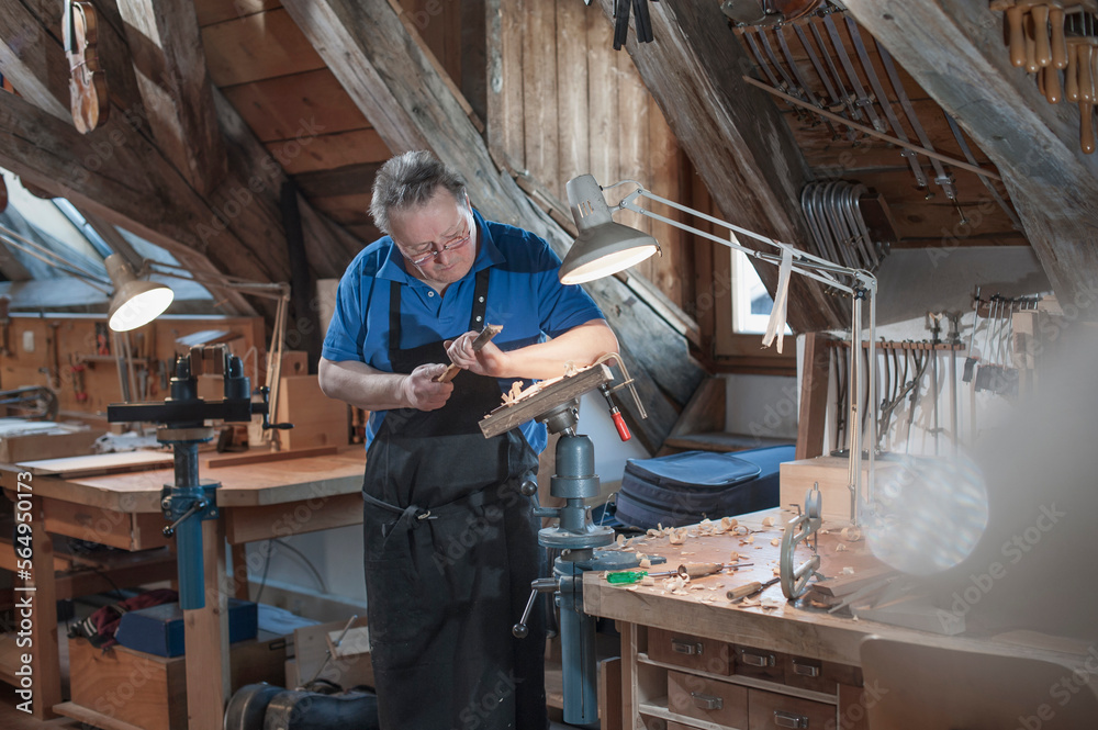 Craftsman carving at workshop Craftsman carving at workshop