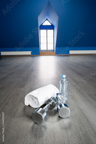 Empty fitness training room towel barbell water
