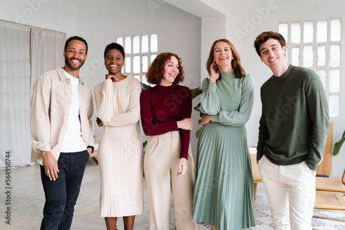 Diverse Cheerful Employees In Spacious Office